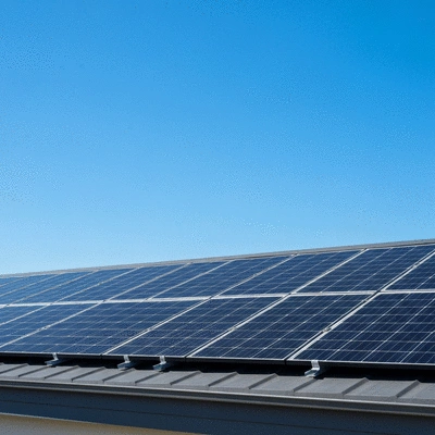 Modern solar panels on a residential rooftop with a clear blue sky background, symbolizing clean energy savings, no text, no words, no typography, 8K