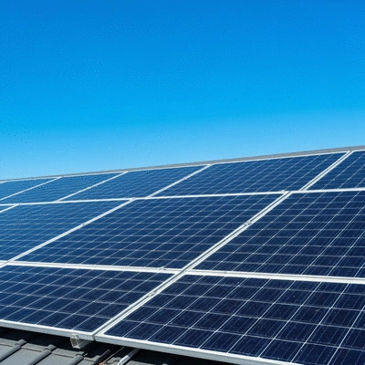 Solar panels on a residential rooftop with a clear blue sky